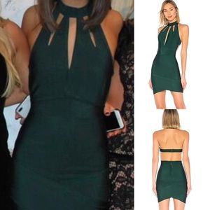 Green halter dress with cut outs and open back